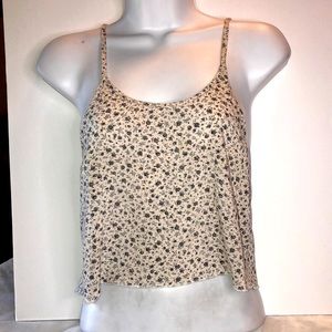 Brandy Melville tank-lightweight. Floral   swingy bottom. Fits small